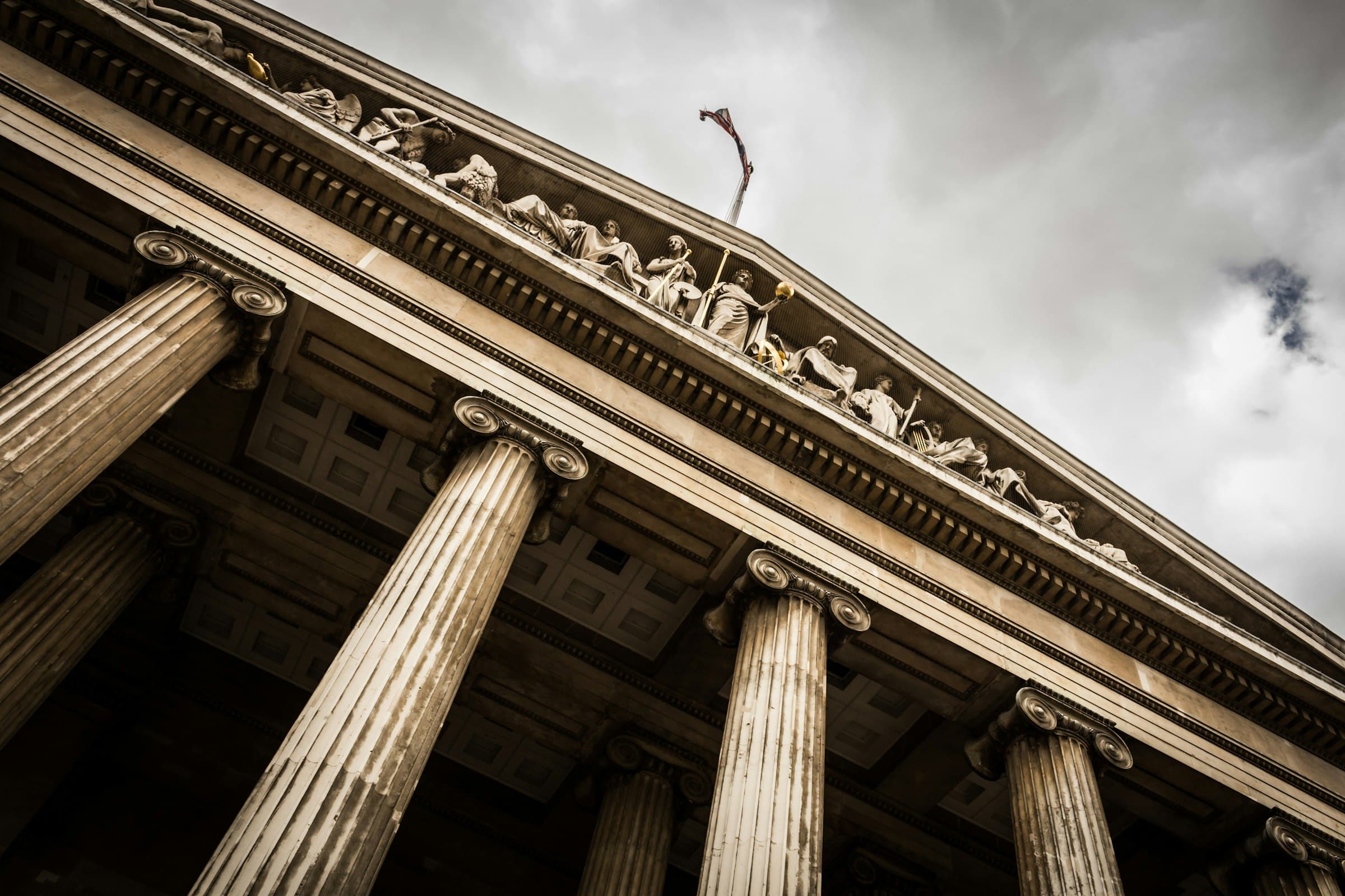 Neoclassical courthouse columns and pediment sculptures